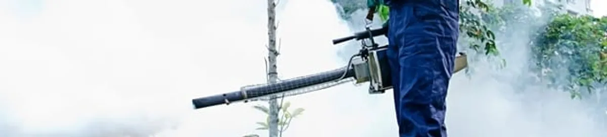 Pest control technician fogging an outdoor area for insect control in Cincinnati, OH