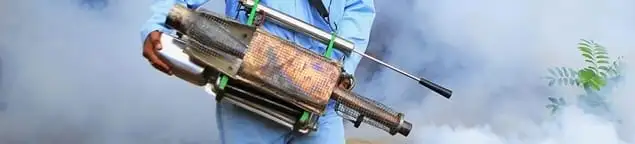 Fumigation technician using a fogger for deep pest treatment in Cincinnati, OH